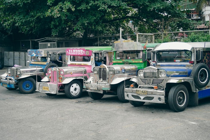 A row of colorful jeepneys parked in the Philippines