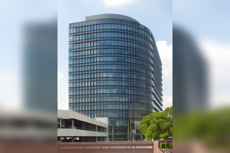 Toyota Motor Corporation headquarters building with distinctive curved glass facade