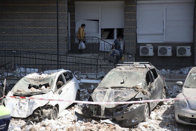 Burned-out cars near a residential building in Kyiv damaged by fragments of a downed drone during a Russian drone attack