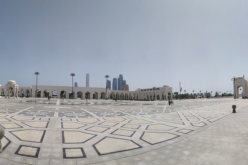 Panoramic view of the Qasr Al Watan presidential palace plaza in Abu Dhabi with the modern city skyline in the background